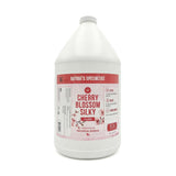 Gallon container of Nature's Specialties Cherry Blossom Silky cologne on a white background