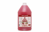 A plastic jug of Nature's Specialties Spiced Cranberry pet shampoo, filled with a deep pink-red liquid, on a solid white background.