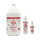 Nature's Specialties Cherry Blossom Silky cologne bottles of different sizes on a white background