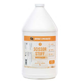 A gallon-size bottle of Nature's Specialties Scissor Stuff Scissoring Spray for groomers.